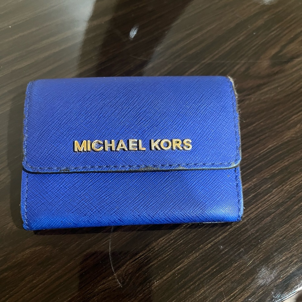 Blue Michael Kors wallet.